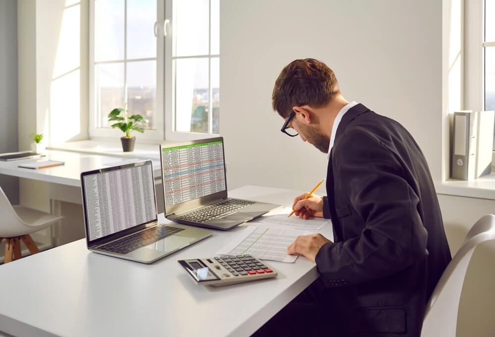 accountant reviewing documents at desk