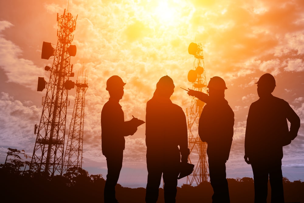 group of public service workers overlooking infrastructure